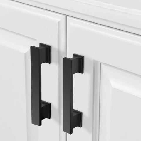 Two Pack 3.75 Inch Matte Black Cabinet Pulls for Kitchen Cabinets and Dressers 96mm Hole Centers shown on white cupboard