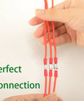 Hands holding connected red wires using 330 Piece Crimp Connector Kit With 2.8mm 4.8mm 6.3mm Spade Terminals Male And Female 15 Types