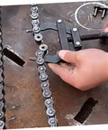 Heavy Duty Dirtbike Chain Tensioner And Motorcycle Chain Adjuster Hand Tool crafted from hella tough steel adjusts a chain.