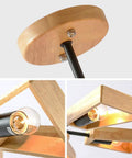 Close-up view of modern metal pendant chandelier base with wooden mount and E27 socket, sleek black finish for dining room.