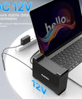 No Sweat Dual Bay Raid Enclosure For 3.5 Inch SATA Hard Drives With Chill Cooling Fan connected to a laptop via USB.