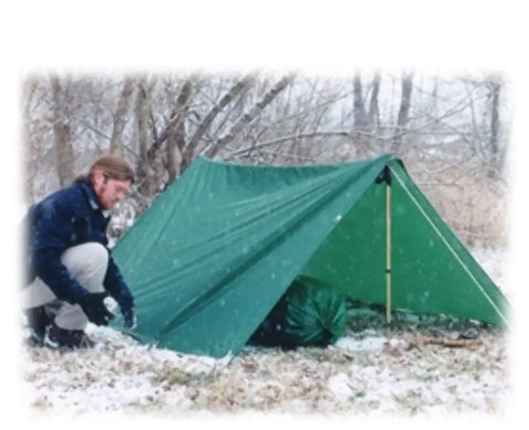 Person setting up Egret Nylon Tarps 12 By 16 Feet Green Lightweight Yet Tough Outdoor Tarp for Camping And DIY Projects in snow