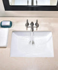 Modern Rectangular Undermount Bathroom Sink 18.5 By 13.8 By 7.9 Inches White Ceramic Lavatory With Overflow in use