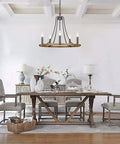 Dining room with Five Light Farmhouse Chandelier with Vintage Candle Look Black Finish hanging above table, 22.8 Inch light fixture.