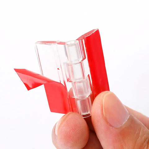 Slick Transparent Acrylic Hinges And Self Adhesive Latch Buckles Kit showing hinge strip with adhesive backing in hand.