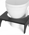 7 Inch Bamboo Toilet Stool For Adults And Kids Poop Stool For Bathroom Use Relieves Bowel Pressure Eases Defecation Anti Slip Grippy Surface Easy Clean Black in front of white toilet
