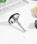 Copper Rotary Bath Tub Stopper with Press Seal for Bathtubs on a countertop, showcasing its shiny copper material and practical design.