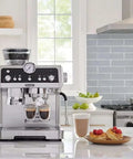 Premium Espresso Machine With Integrated Burr Grinder And Smart Tamping Station in sleek stainless steel finish on countertop.