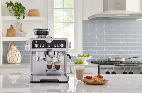 Premium Espresso Machine With Integrated Burr Grinder And Smart Tamping Station in sleek stainless steel finish on countertop.