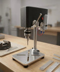 Tiny Tabletop Drill Press Metal Base Stable Workbench Machine Precision Chuck Compact Design For Hobby Projects Garage Repairs Craft Room DIY Power Tool Sturdy And Space Saving Mini Bench Drilling Setup on a wooden workbench.