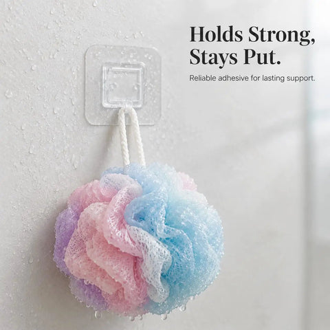 Sick Wall Mount Hooks, Totally Rust Proof Storage Rack For Coats, Bags, And Picture Hanging displaying a bath loofah on a clear adhesive hook.