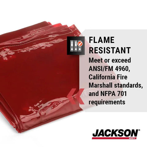 Red flame-resistant welding curtain meets safety standards, folded in stack. Transparent Welding Curtain Screen With UV And Blue Light Protection Multiple Colors And Sizes For Clear Visibility And Noise Reduction In Every Welding Setup For Any Shop Or Garage. Close-up view.