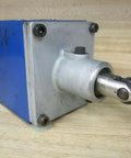 Bosch Rexroth R900590253 Hydraulic Valve 4WMU10D31 with limit switch roller, angled view showing roller mechanism on wooden surface.