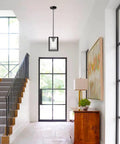 Single Black And Brushed Nickel Pendant Light With Clear Glass Shade Sleek Modern Industrial Chandelier in a foyer