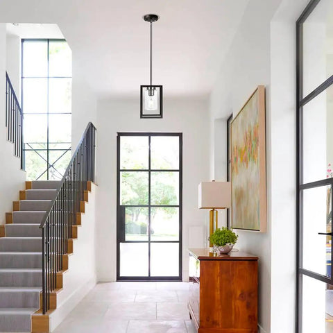 Single Black And Brushed Nickel Pendant Light With Clear Glass Shade Sleek Modern Industrial Chandelier in a foyer