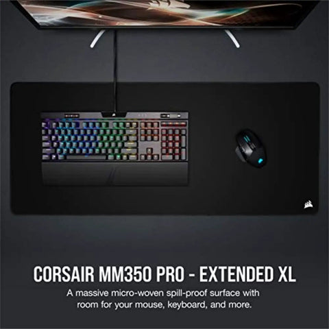 Top view of MM350 PRO Extended XL Spill Proof Cloth Gaming Mouse Pad with keyboard and mouse on 930mm by 400mm surface, black.