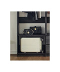 Freestanding Wooden Closet System Featuring Modular Cubbies And Hanging Rods Delivers Totally No Sweat Customizable Wardrobe Storage For Clothes Shoes And Accessories In Sleek Gray with bag and suitcase.