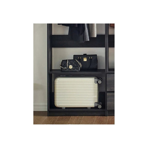 Freestanding Wooden Closet System Featuring Modular Cubbies And Hanging Rods Delivers Totally No Sweat Customizable Wardrobe Storage For Clothes Shoes And Accessories In Sleek Gray with bag and suitcase.