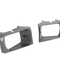 Pair Headlight Bezel Cover For 1999 2004 Ford F Series Super Duty F250 F350 F450 F550 silver bezels set on white background