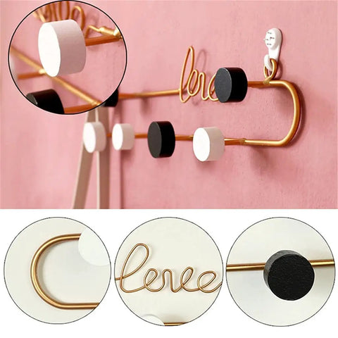 Hella Sturdy Decorative Wall Hooks Heavy Duty Metal Row Mounts For Hanging Coats Hats Keys Bags Rustic Iron Art Home Organizer on pink wall.