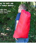 Man carrying Red Six Piece Dog Agility Training Kit With Weave Poles, Tunnels, Adjustable Jump, Pause Box And Panels