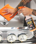 Person applying Bead Maker Paint Sealant For No Fuss Spray And Wipe Protection On Cars, Boats, And RVs With Hydrophobic Gloss