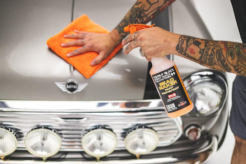 Person applying Bead Maker Paint Sealant For No Fuss Spray And Wipe Protection On Cars, Boats, And RVs With Hydrophobic Gloss