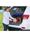 Woman using 12V DC Multipurpose Inflator With Digital Gauge, High-Volume For Air Mattresses And Rafts, in car trunk