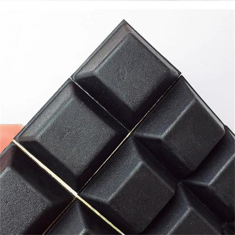 Dead Set Solid Self Adhesive Rubber Feet Pads With Super Sticky Backing Non Slip Furniture Bumpers And Silent Anti Vibration Grips For Sofas And Tables No Wiggle Quick Install 16 Pack Black close-up of black polyurethane pads showing square shape and texture.