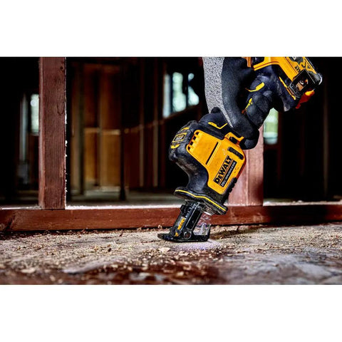 Person using Atomic 20V Max One-Handed Cordless Reciprocating Saw Tool Only With Brushless Motor in a construction setting.