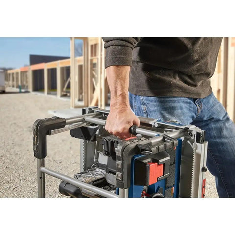 Heavy Hitter 18v Portable Table Saw 8 1/4 Inch Blade Bare Tool with rugged carry frame held by hand on job site.