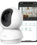 2K Pan Tilt Home Security Camera For Baby And Pet Monitor with smartphone app interface showing live video feed of a dog on a sofa