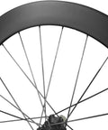 Close-up of Carbon Wheelset For Road Bikes 700C 60mm Depth Through Axle Disc Brakes With Locking Hub T800 Carbon Fiber rim.