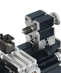 Close-up of Heavy Duty Mini Metal Lathe featuring a metallic build, precision chuck, and tooling for machining aluminum, wood, and plastic.