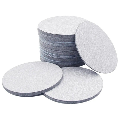 Top Notch 9 Inch Sanding Discs 100 Pack Wet Dry Alumina Paper 60 To 1000 Grit Set stacked with circular grits for various surfaces.