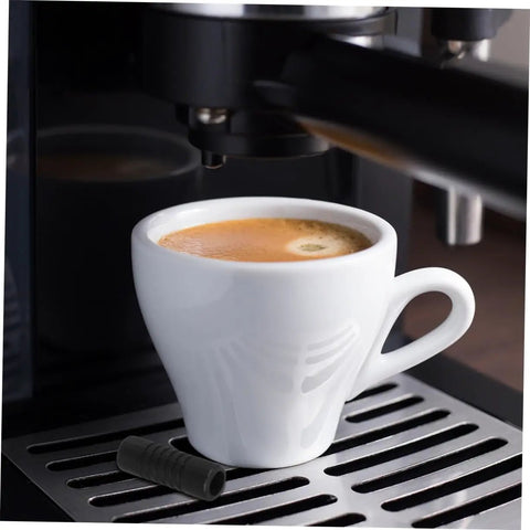 Coffee Steam Wand Guard Set Rubber Steam Pipe Covers For Espresso Machines 2 Pack shown beside espresso cup