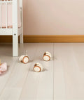 4pcs PU Grip Neck Stem Casters for Nursery Carts and Bookcase on light floor near crib with baby items.
