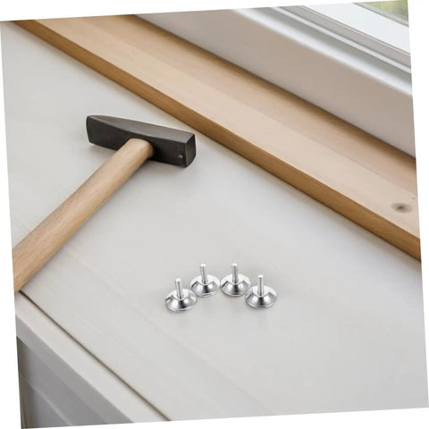 Heavy Duty Adjustable Furniture Levelers And Metal Screw Feet With Grippy Rubber Pads To Fix Wobbly Cabinets Tables Chairs And Dressers Zero Sweat Quick Install with hammer and silver feet on a table.