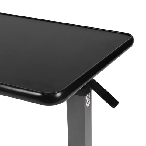 Heavy Duty Adjustable Overbed Table With Ball Bearing Casters, Versatile Rolling Bedside Desk For Hospital Couch Or Wheelchair, No Hassle Portable Laptop Stand For Home, close-up of black tabletop with hydraulic adjustment lever.