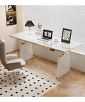 Smooth Rise Electric Sit Stand Desk With Four Memory Presets And A Sleek Slate Surface For A Top Tier Home Office Setup, sleek design with laptop and chair.