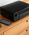 7.2 Channel AV Receiver With Built-In HEOS And 8K HDMI Dope Wireless Streaming Dolby Atmos resting on wood surface