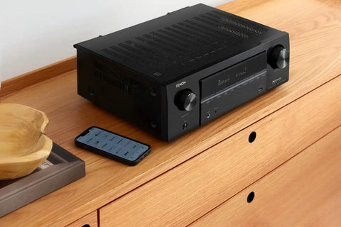 7.2 Channel AV Receiver With Built-In HEOS And 8K HDMI Dope Wireless Streaming Dolby Atmos resting on wood surface