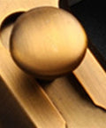 Close-up of the round knob on a Door Window Gate Garage Security Snap Lock Sliding Bolt Zinc Alloy Buckle.