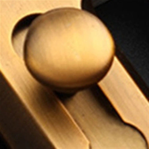 Close-up of the round knob on a Door Window Gate Garage Security Snap Lock Sliding Bolt Zinc Alloy Buckle.