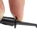 Close-up of 5 Pack Black PCB IC Test Probes Set With Spring Clip Test Hooks held between fingers, compact 43x12x9mm size