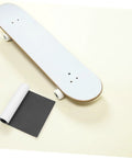 Two Pack Black PVC Grip Tape Sheets For Skateboard And Scooter Decks Weatherproof No Slip Traction beside white skateboard