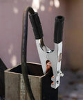 Heavy Duty Welding Ground Clamp With Copper And Iron Build Designed For Secure Earth Connection Plus Strong Load Bearing Capabilities To Keep Your Setup Safe And Steady While Getting Work Done Any Day attached to a metal workpiece.