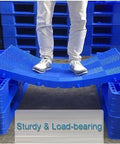 Person standing on flexible Lightweight Interlocking Plastic Pallet With Breathable Grid For Garage Storage Basement Kitchen And Supermarket Shelving 100x50x5 Cm Durable Reusable Anti Aging Platform.