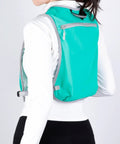 Back view of Run Ready Hydration Vest Lightweight Running Backpack with adjustable water bag in blue, worn by person.