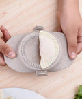 Hassle Free Wheat Straw Dumpling Press three sizes showing a homemade ravioli being pressed, lightweight foldable kitchen gadget.